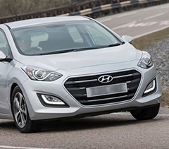 gray i30 Hyundai in motion
